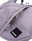 Interior of HAZE crossbody bag showing zip pocket