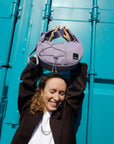 Person wearing HAZE crossbody bag in Concrete Lilac